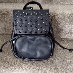 Small black studded backpack